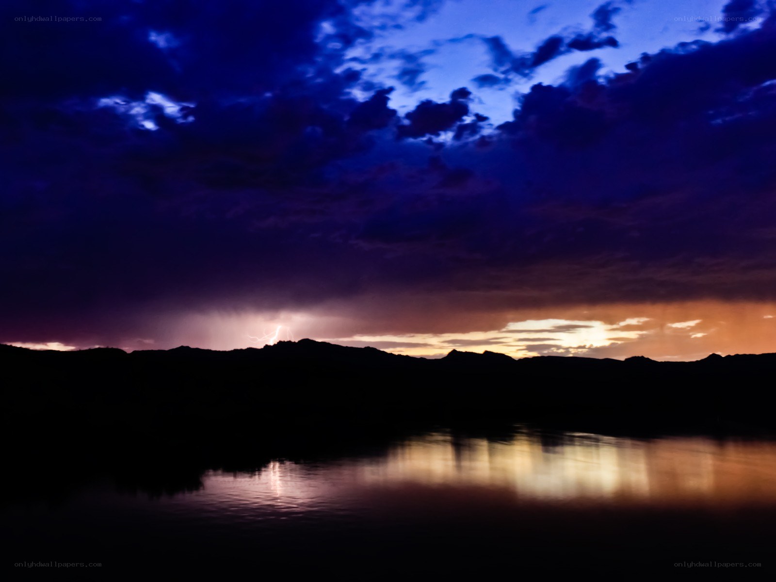 Lightning over a lake at dusk