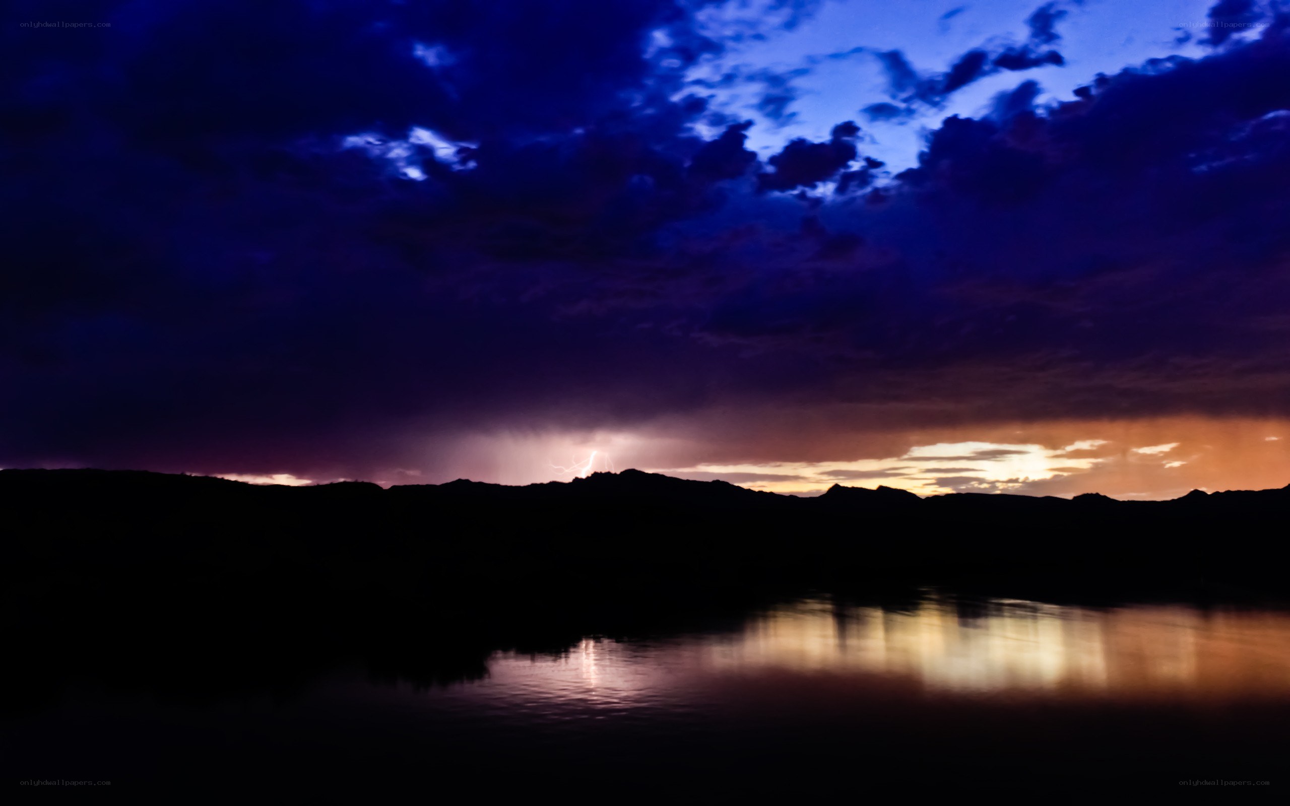 Lightning over a lake at dusk