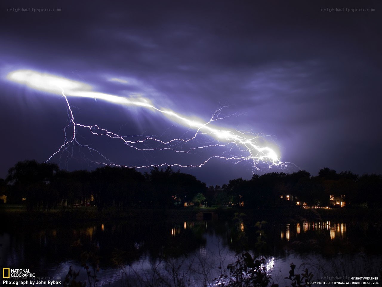 Lightning over a lake at night