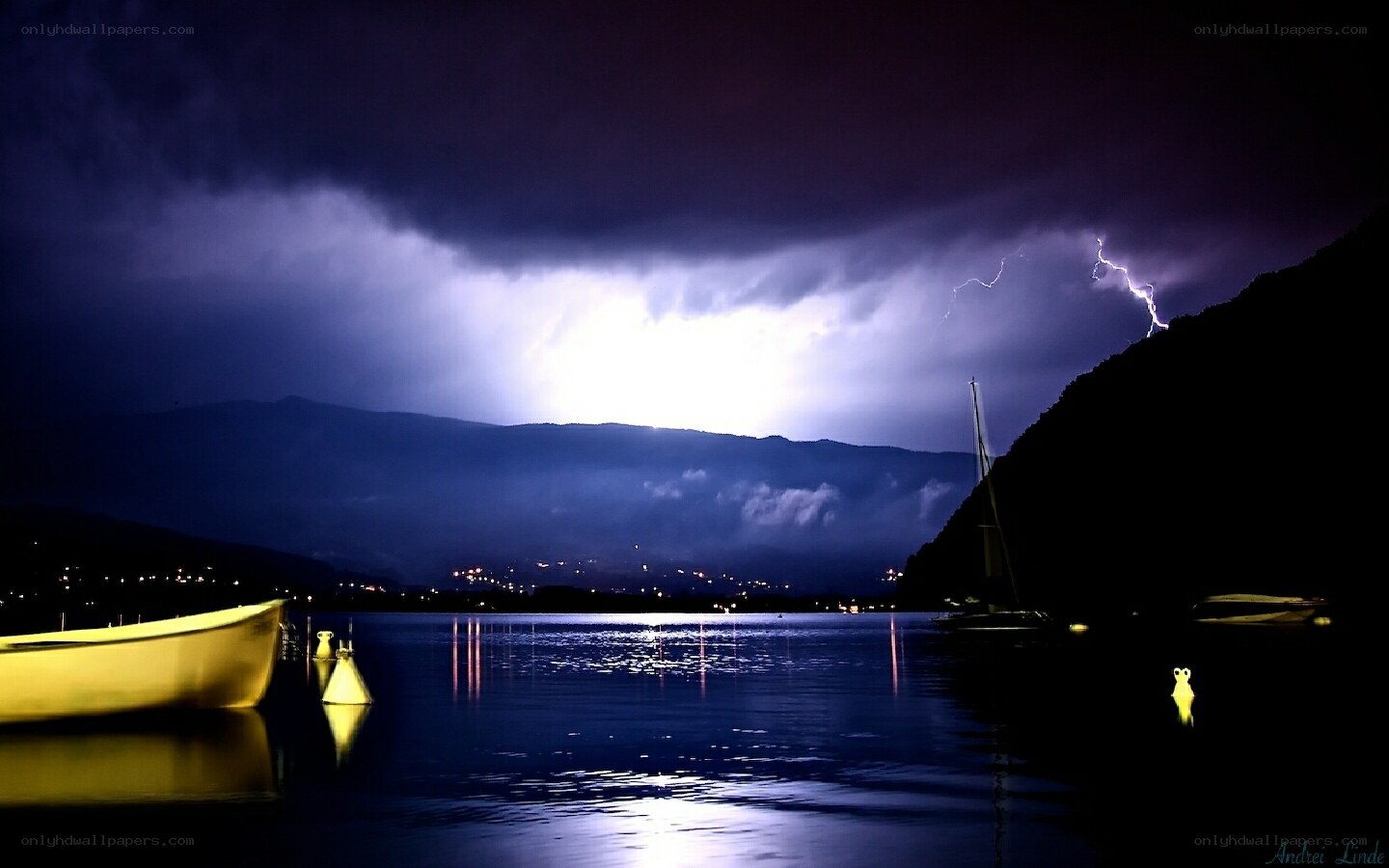 Lightning over a lake at night