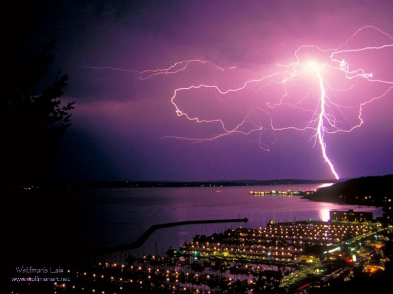 Lightning over a marina at night