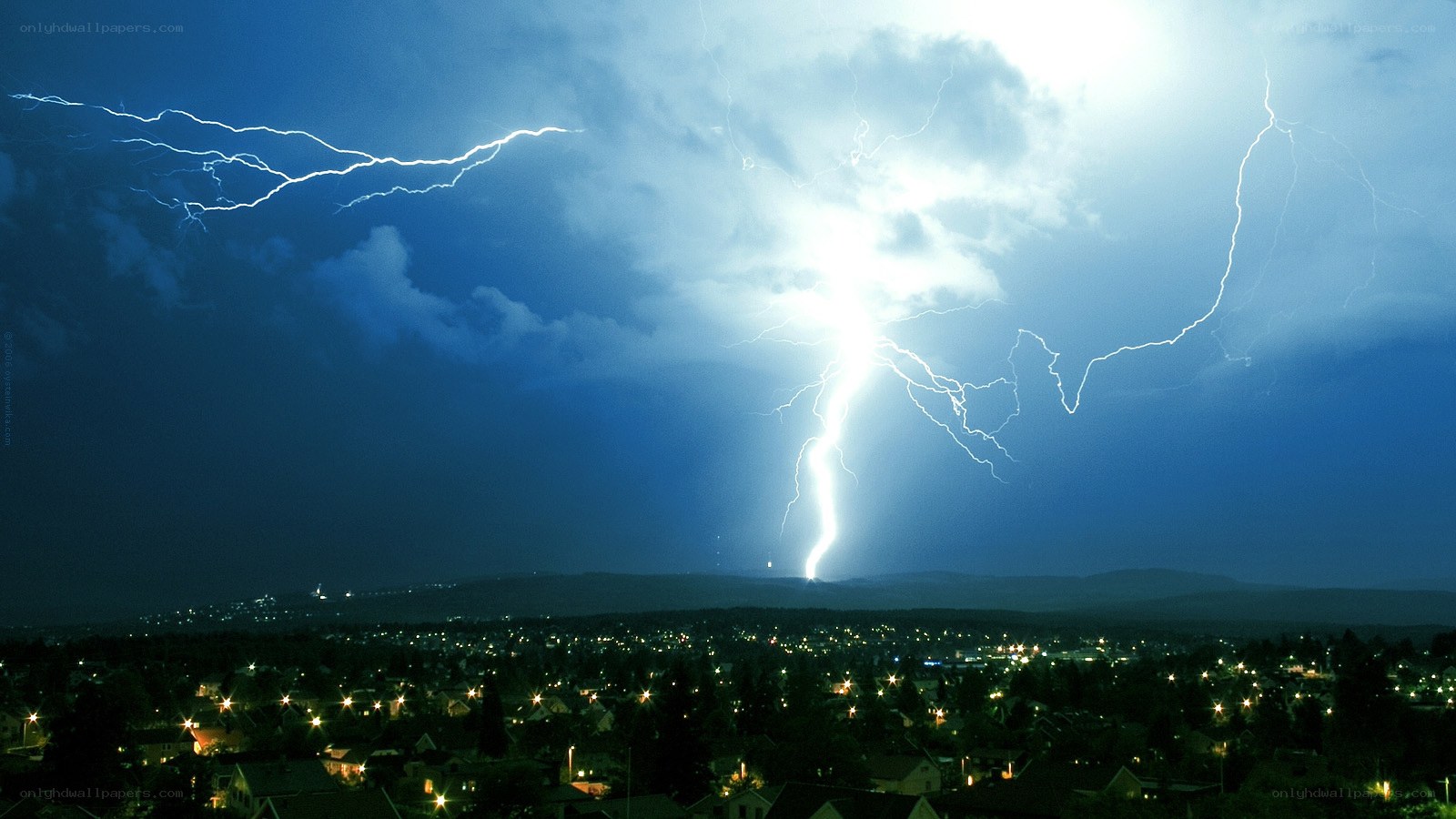 Lightning over a town at night