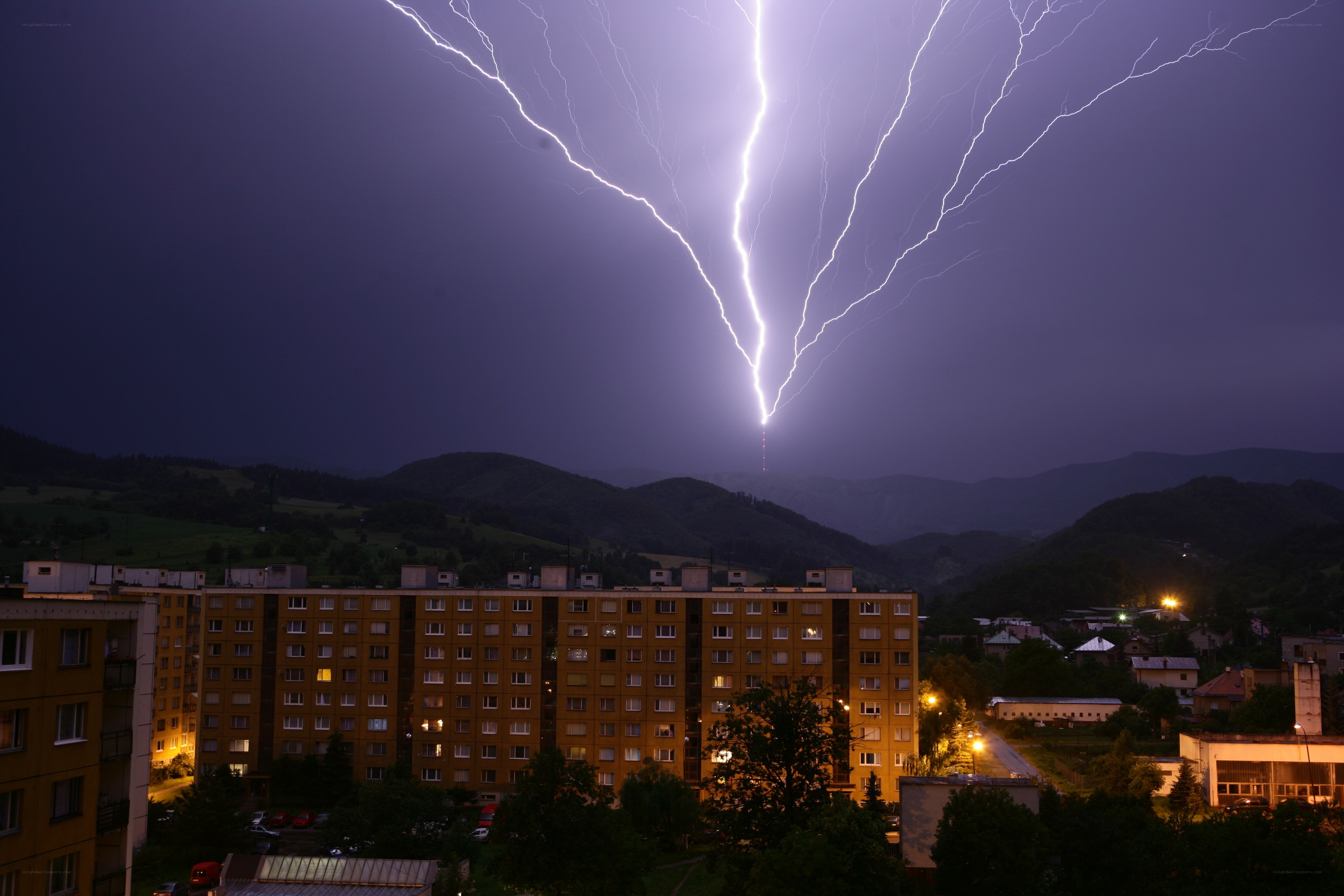 Lightning over a town at night