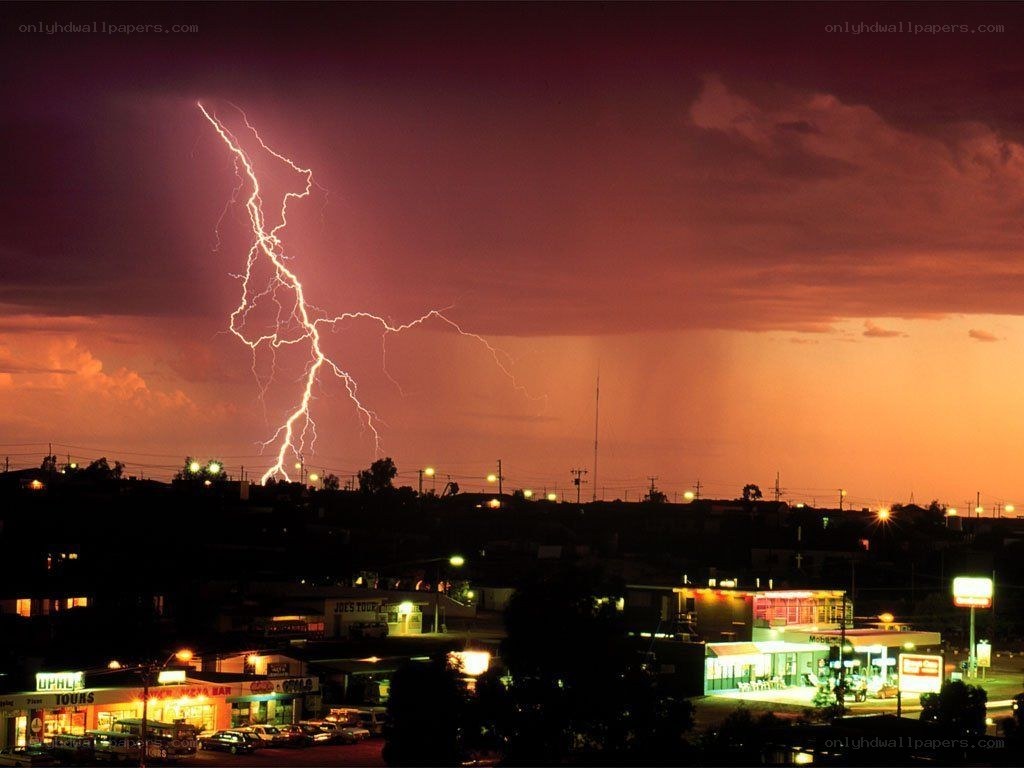 Lightning over a town at night
