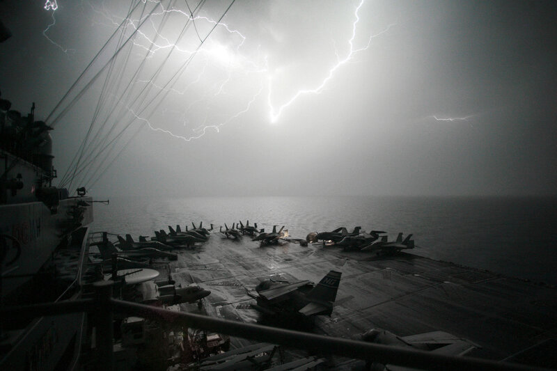 Lightning over aircraft carrier