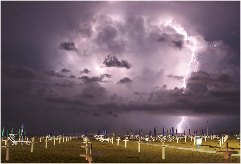 Lightning over beach at night