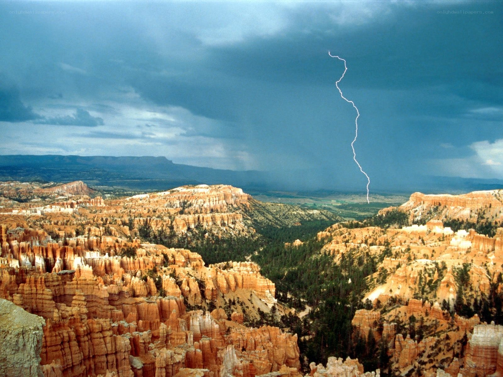 Lightning over canyon landscape
