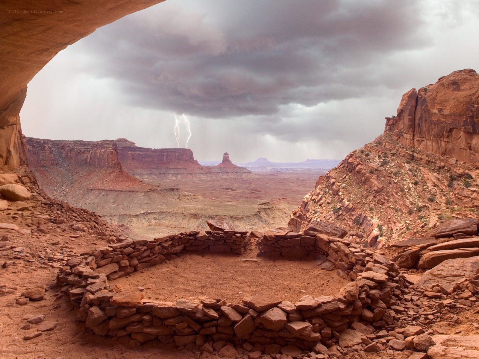 Lightning over canyon ruins