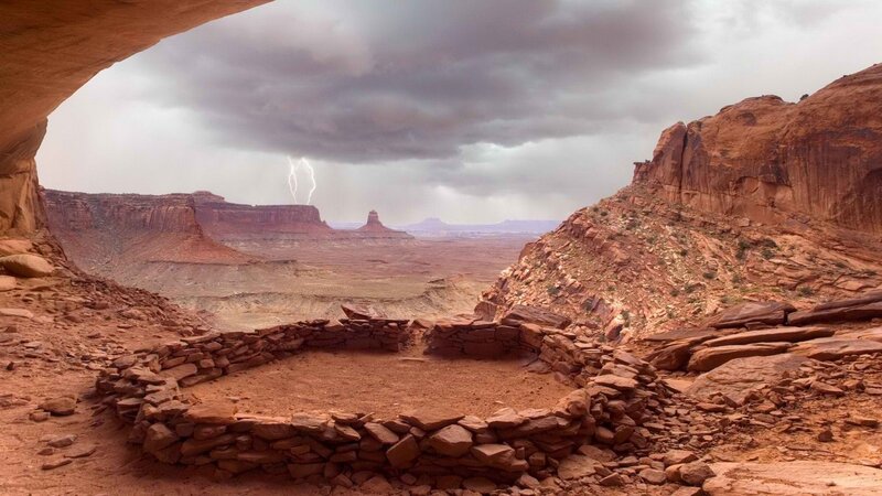 Lightning over canyon ruins