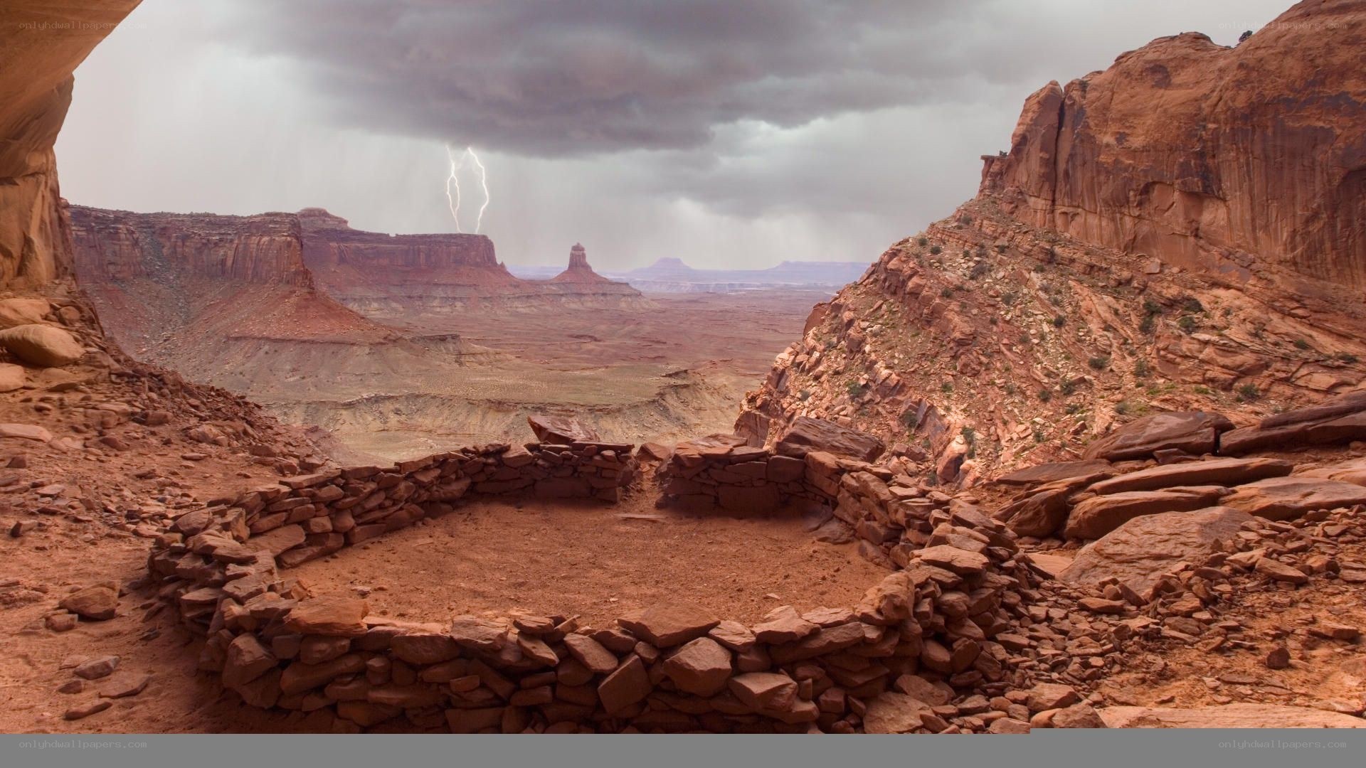 Lightning over canyon ruins
