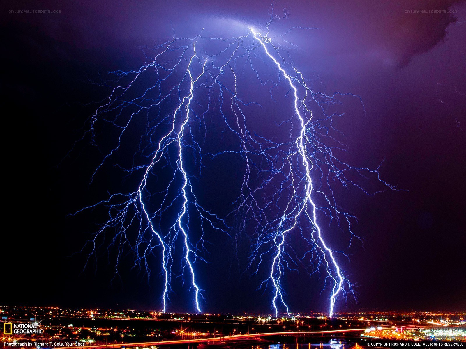 Lightning over city at night