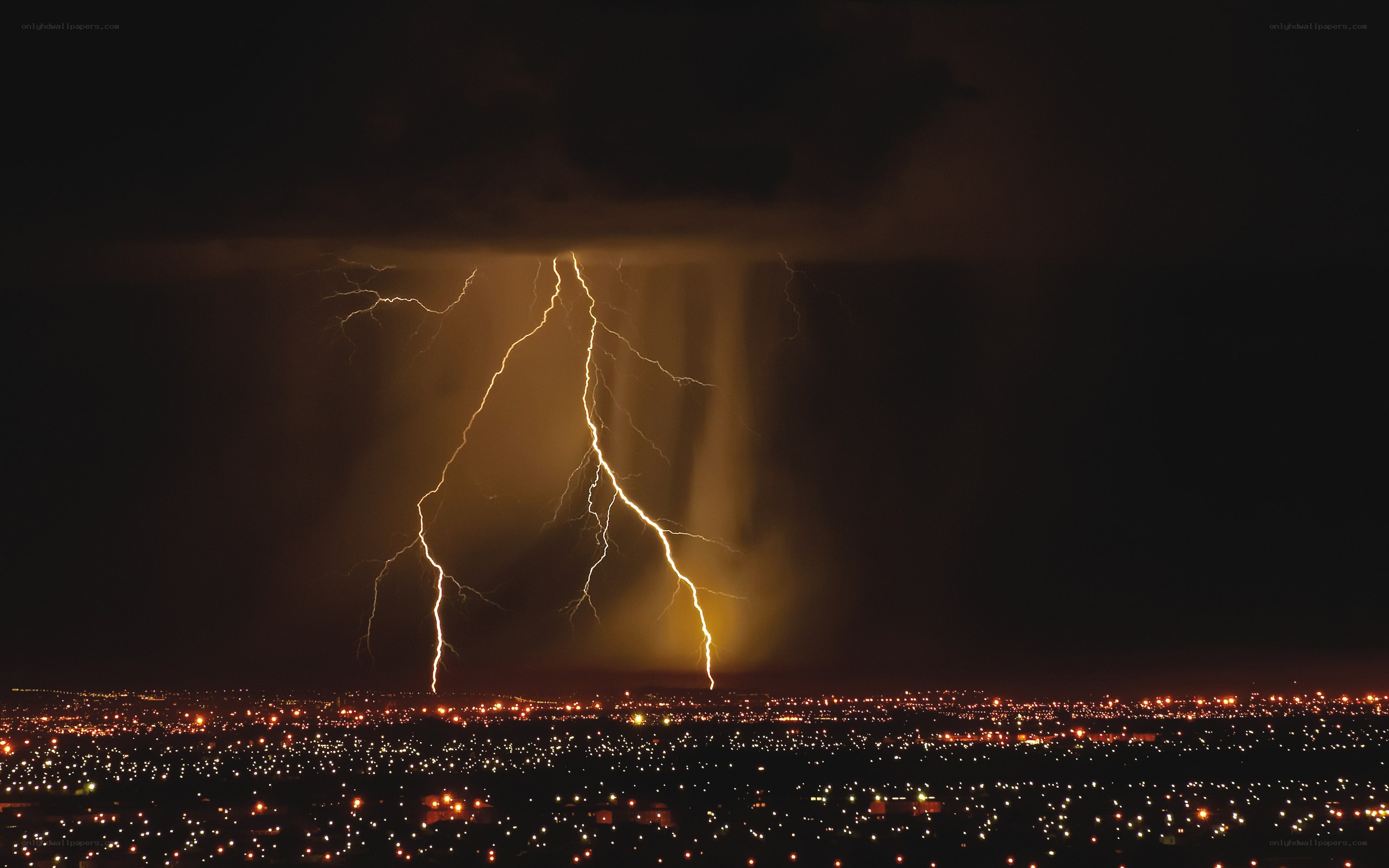 Lightning over city at night