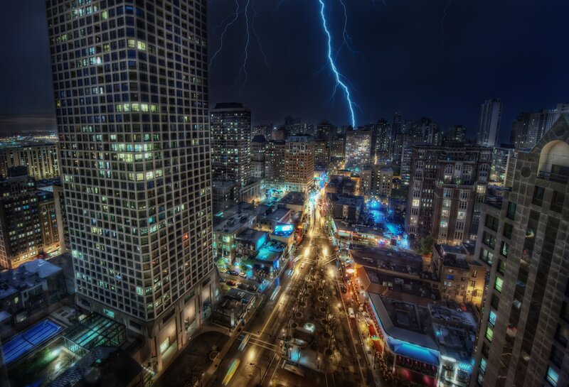 Lightning over city at night