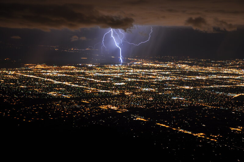 Lightning over city at night