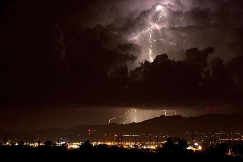 Lightning over city at night