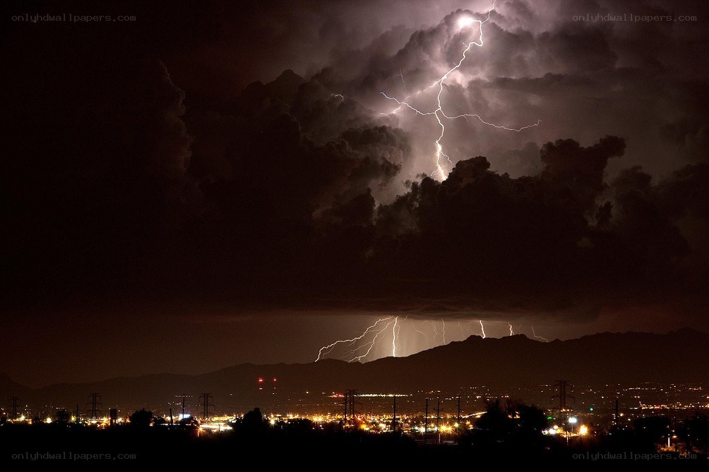 Lightning over city at night