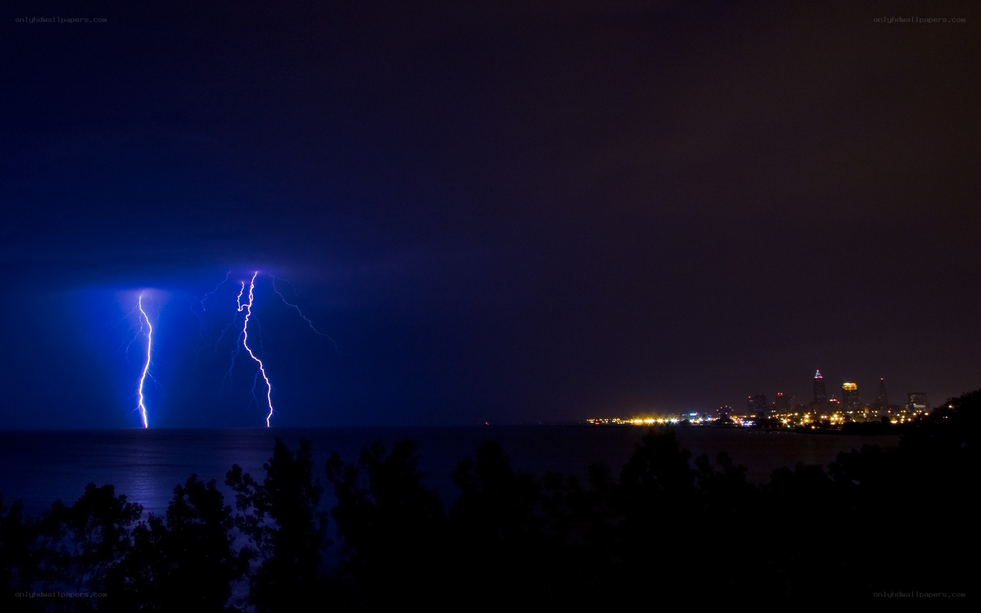 Lightning over city at night