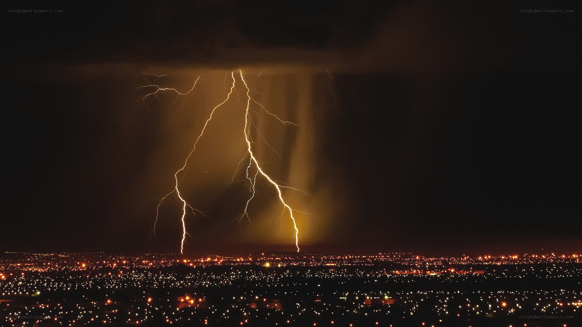 Lightning over city at night