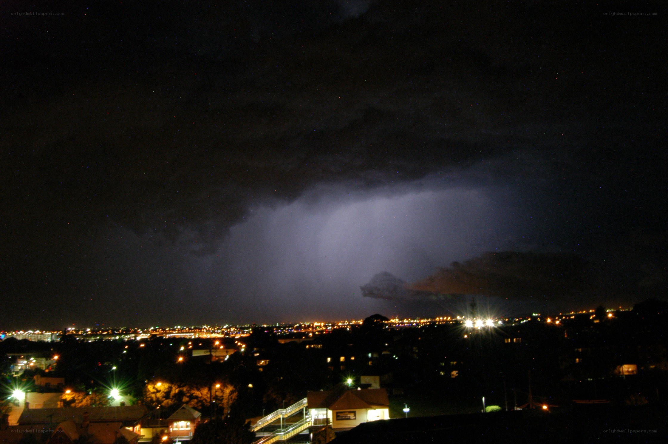 Lightning over city at night
