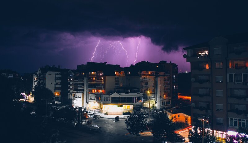 Lightning over city at night