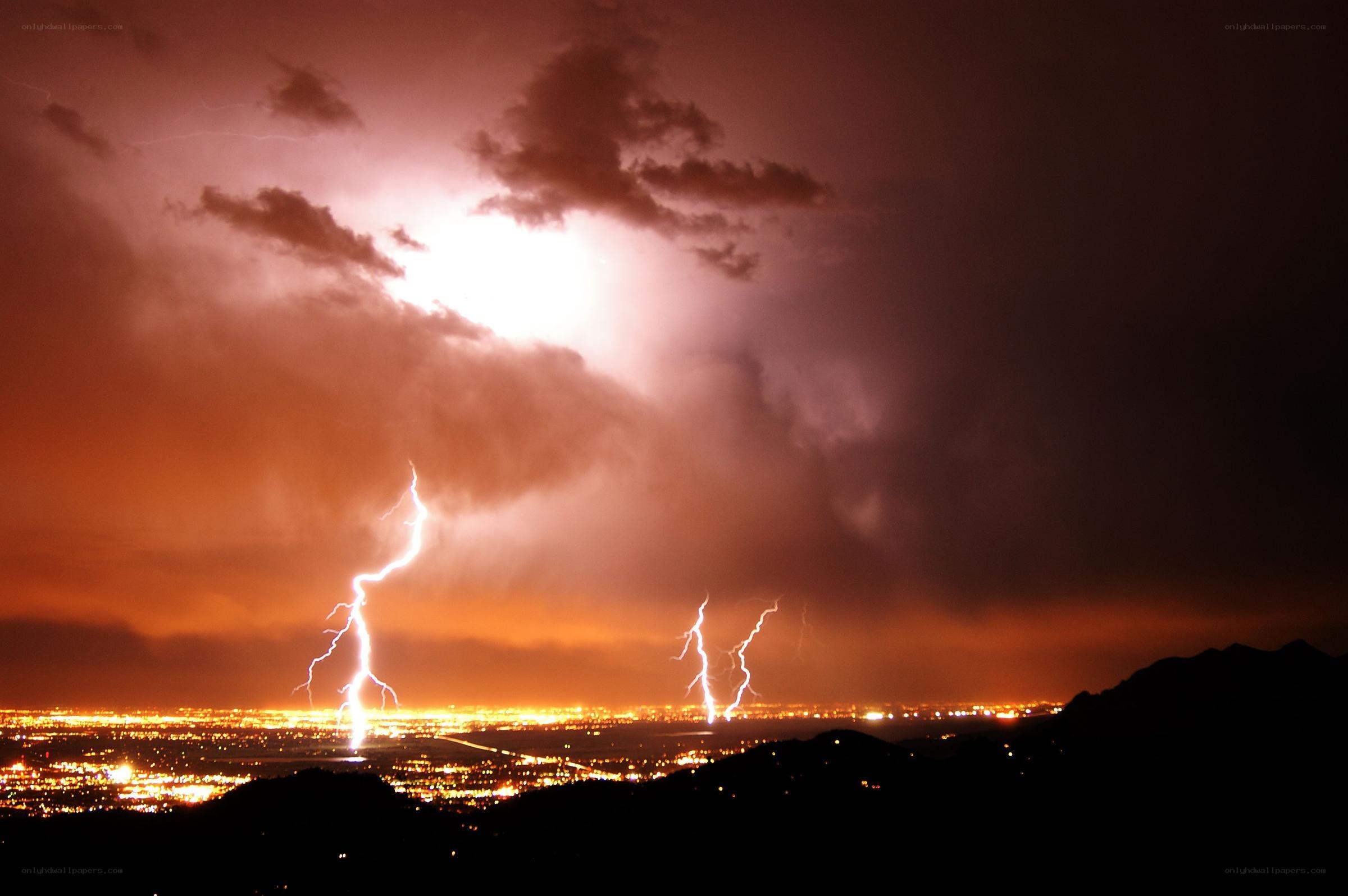 Lightning over city at night
