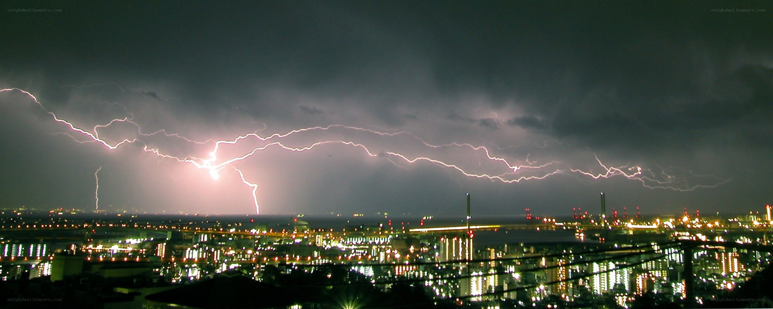 Lightning over city at night