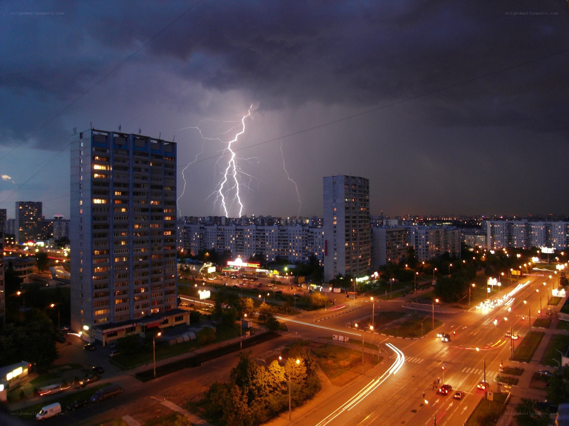 Lightning over city at night