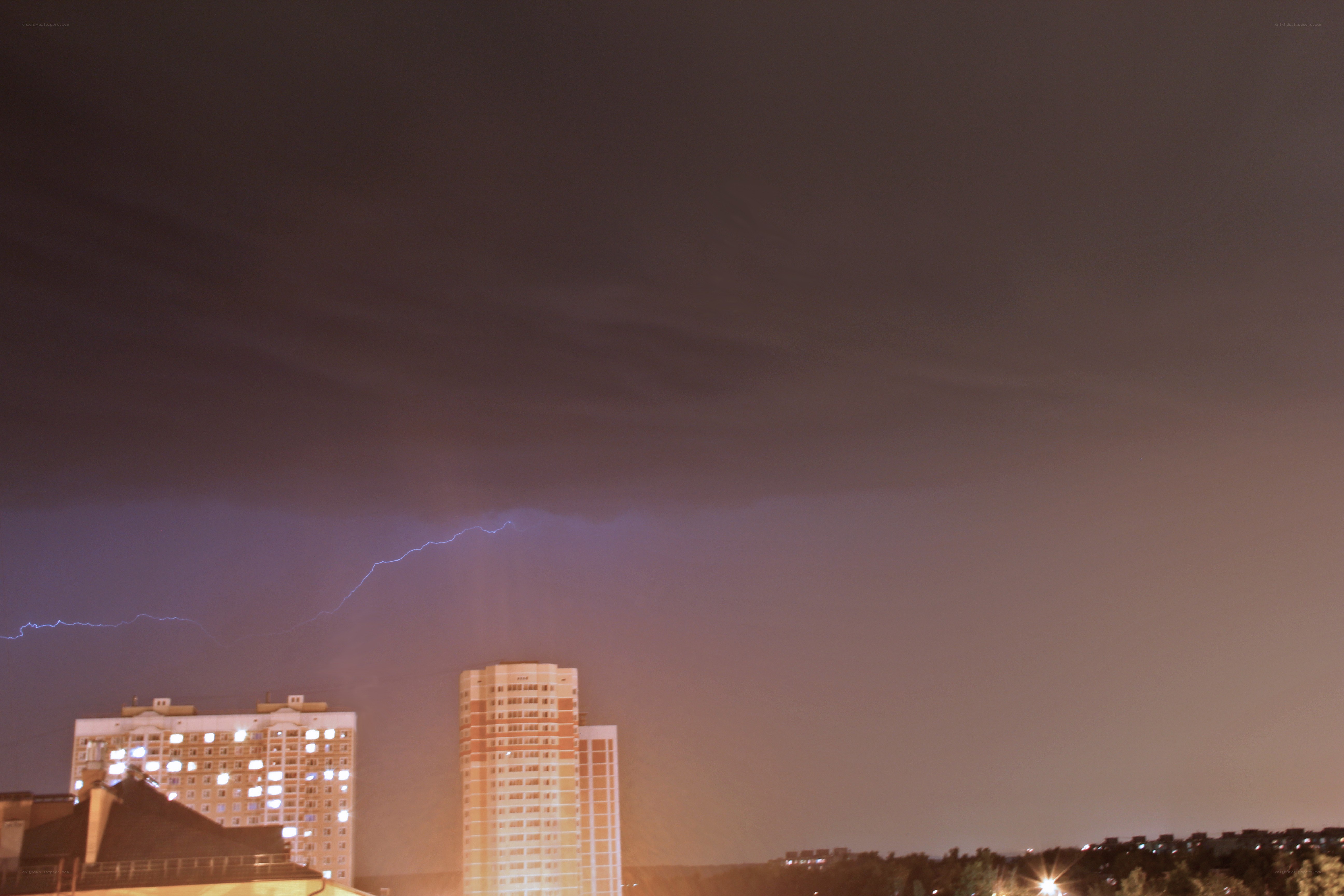Lightning over city buildings
