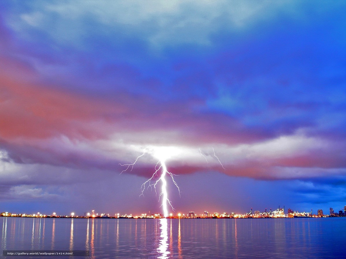 Lightning over city harbor