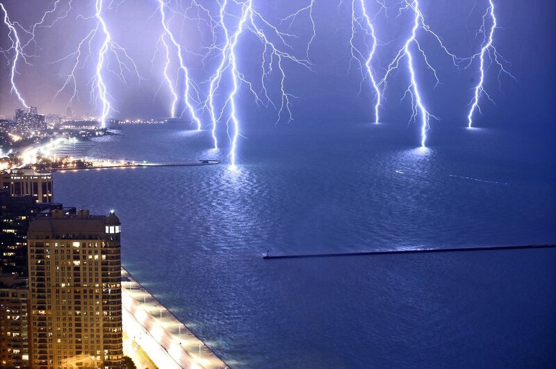 Lightning over city lake