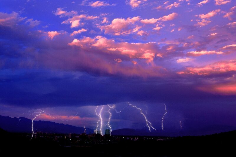 Lightning over City — Mountains