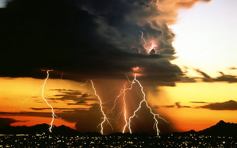 Lightning over City — Orange, Dramatic, Sunset