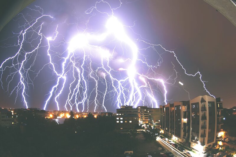 Lightning over City — Purple, Dramatic, Night, Photograph, Buildings, Trees, Lights