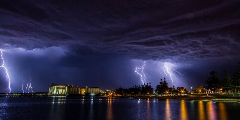 Lightning over City — Purple, Dramatic, Night, Photograph, Buildings, Trees