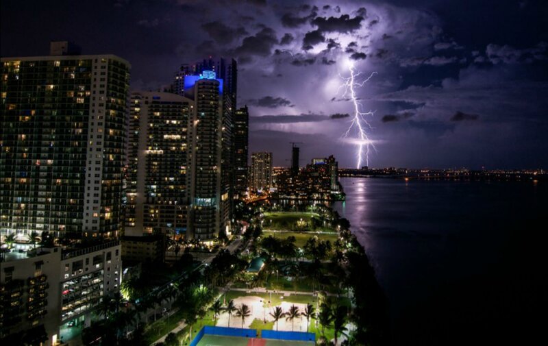 Lightning over City — Purple, Dramatic, Night, Photograph, Skyscrapers, Water