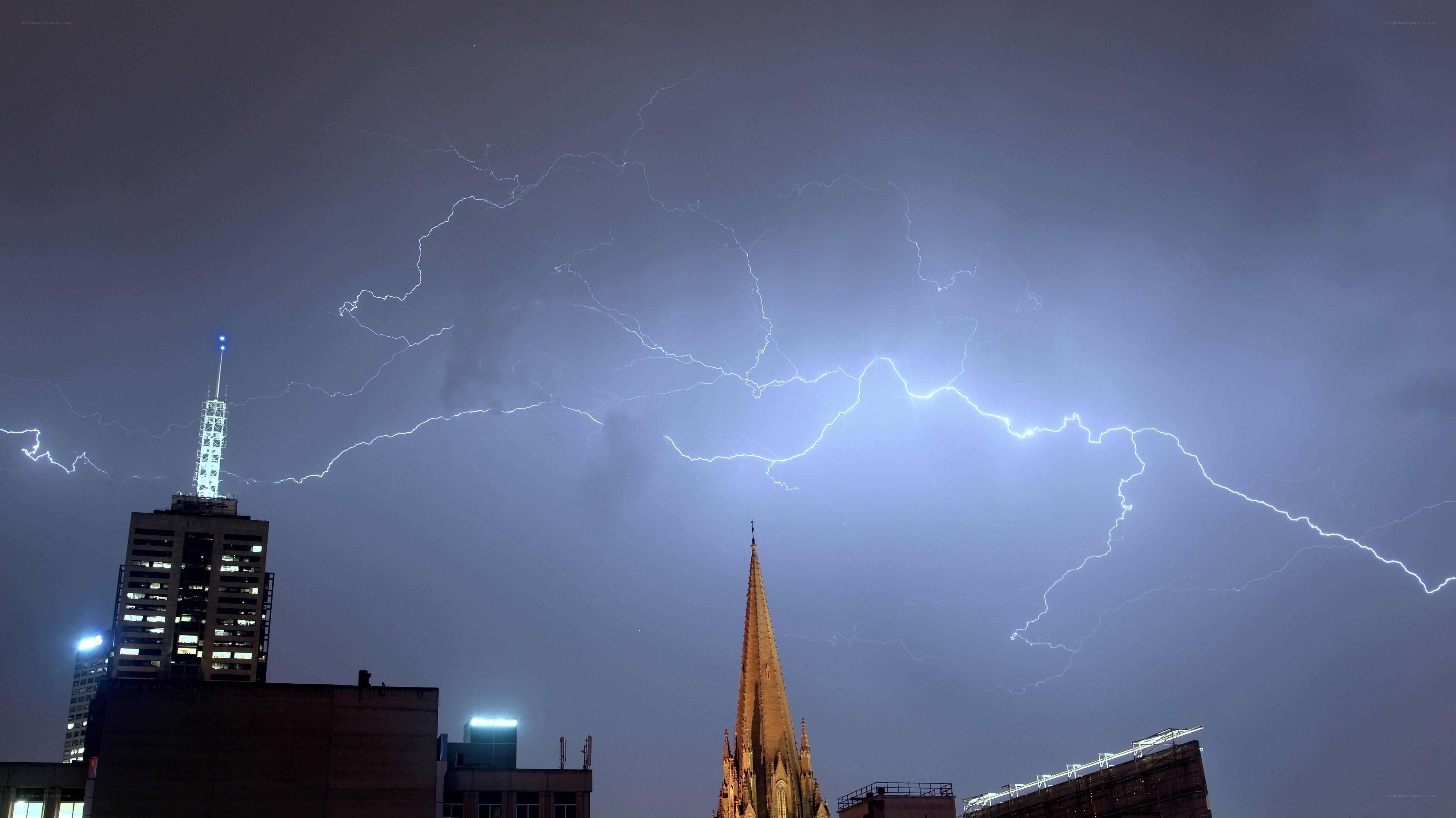 Lightning over city skyline