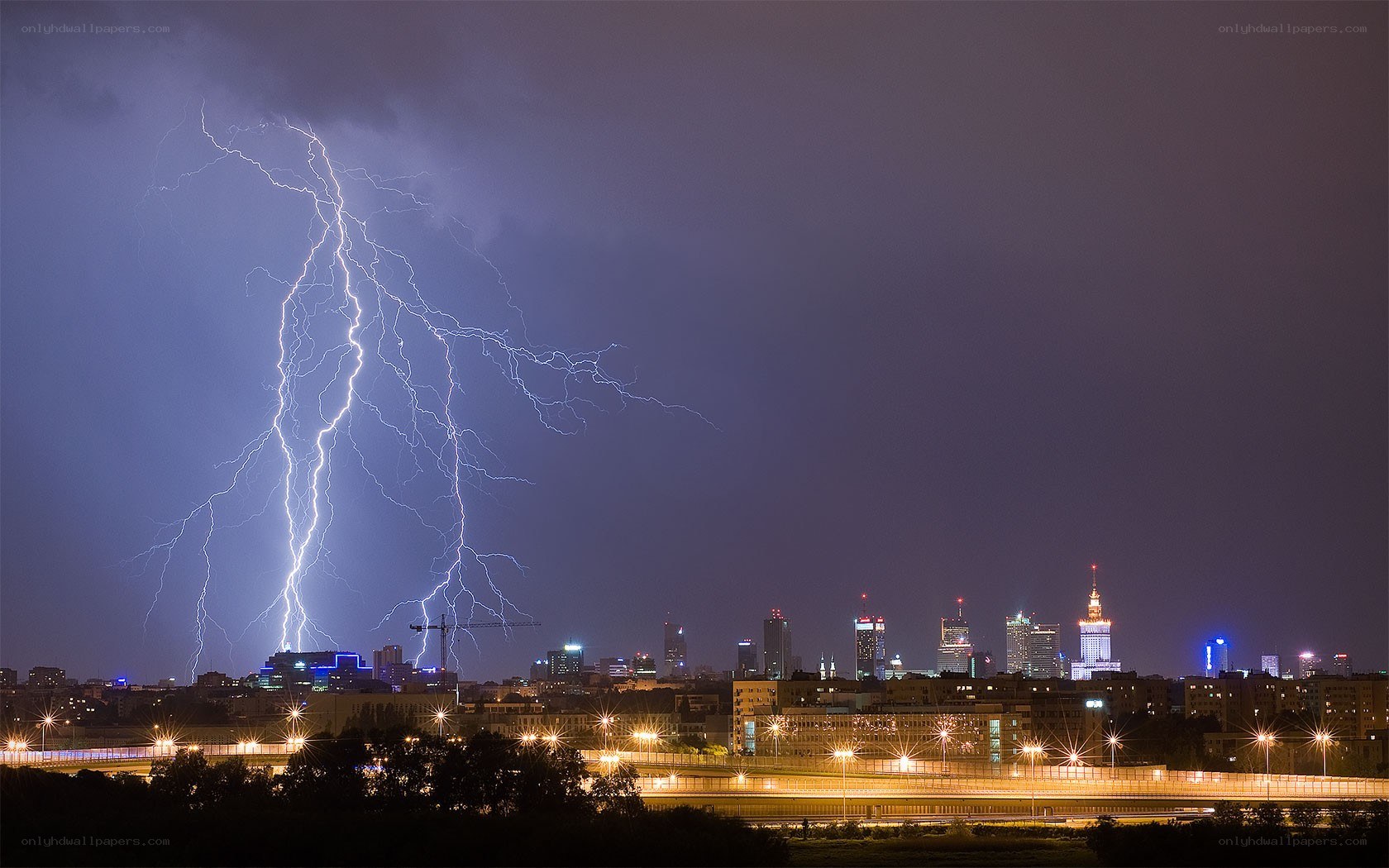 Lightning over city skyline