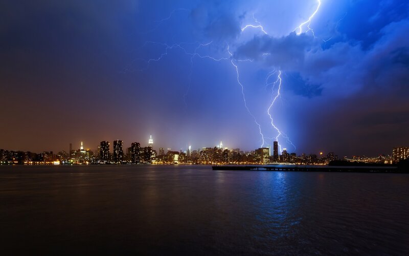 Lightning over city skyline