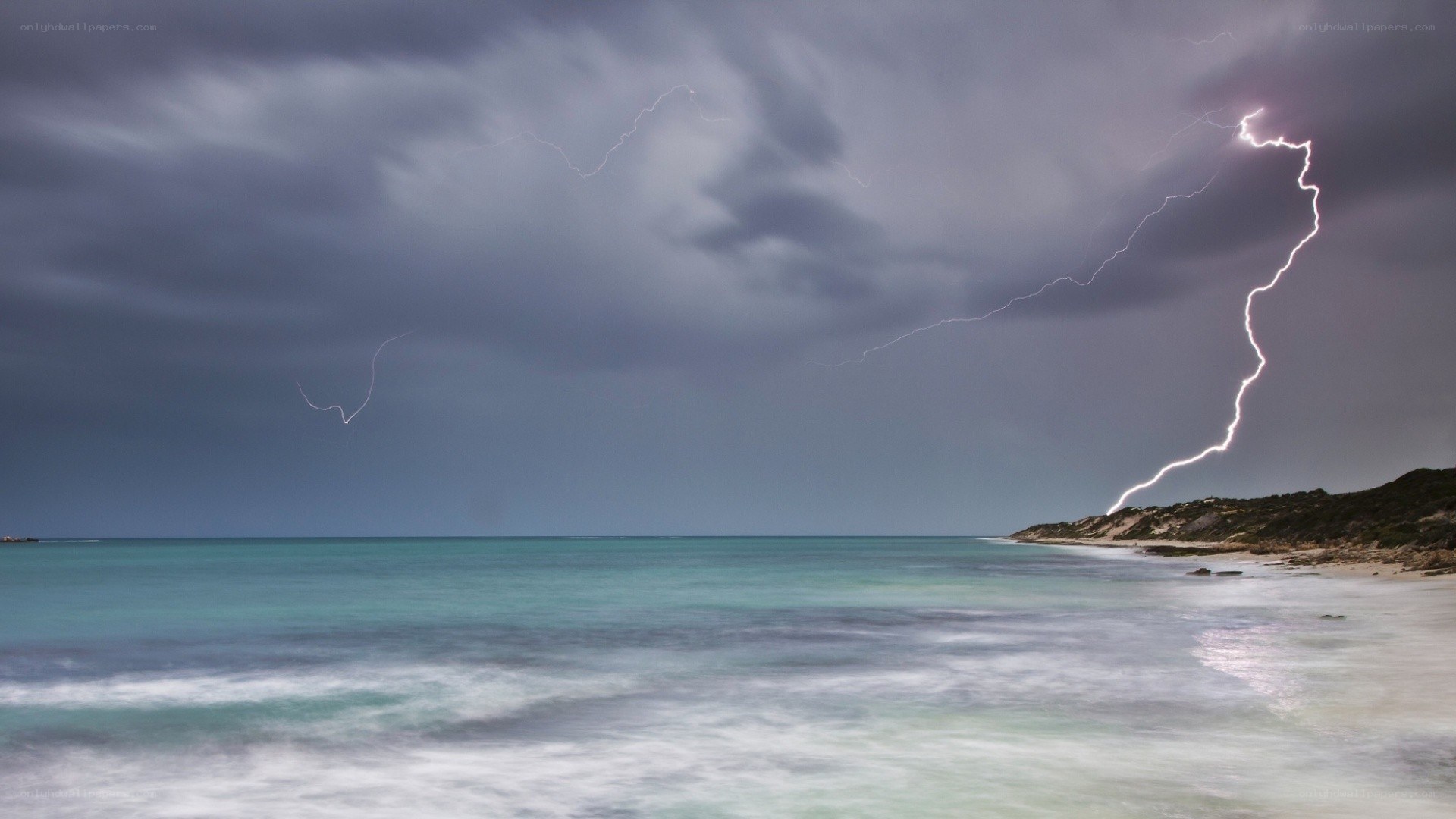 Lightning over coastal beach