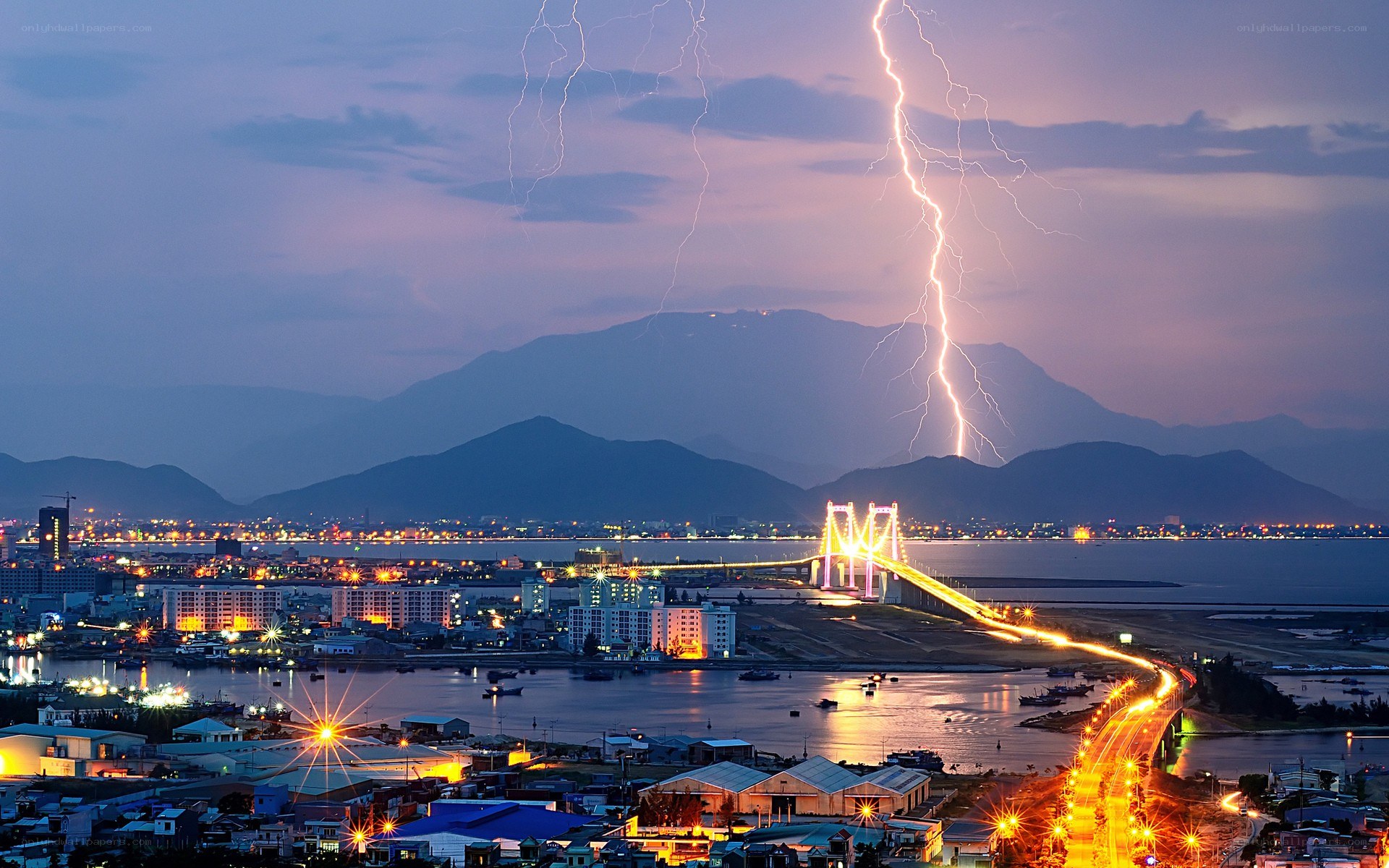 Lightning over coastal city