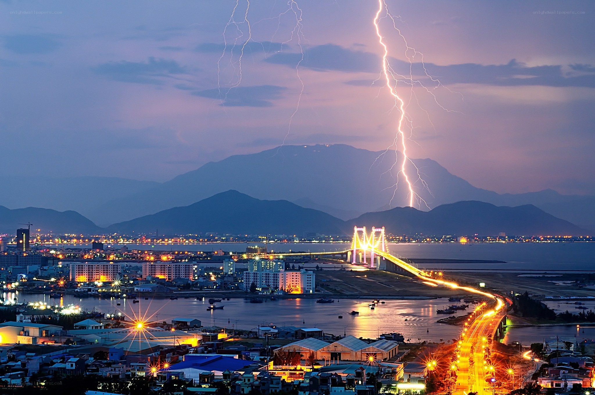 Lightning over coastal city