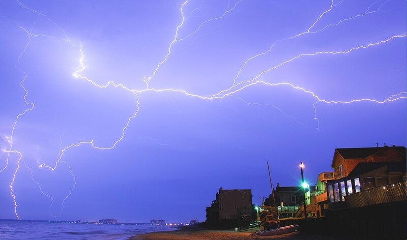 Lightning over coastal homes