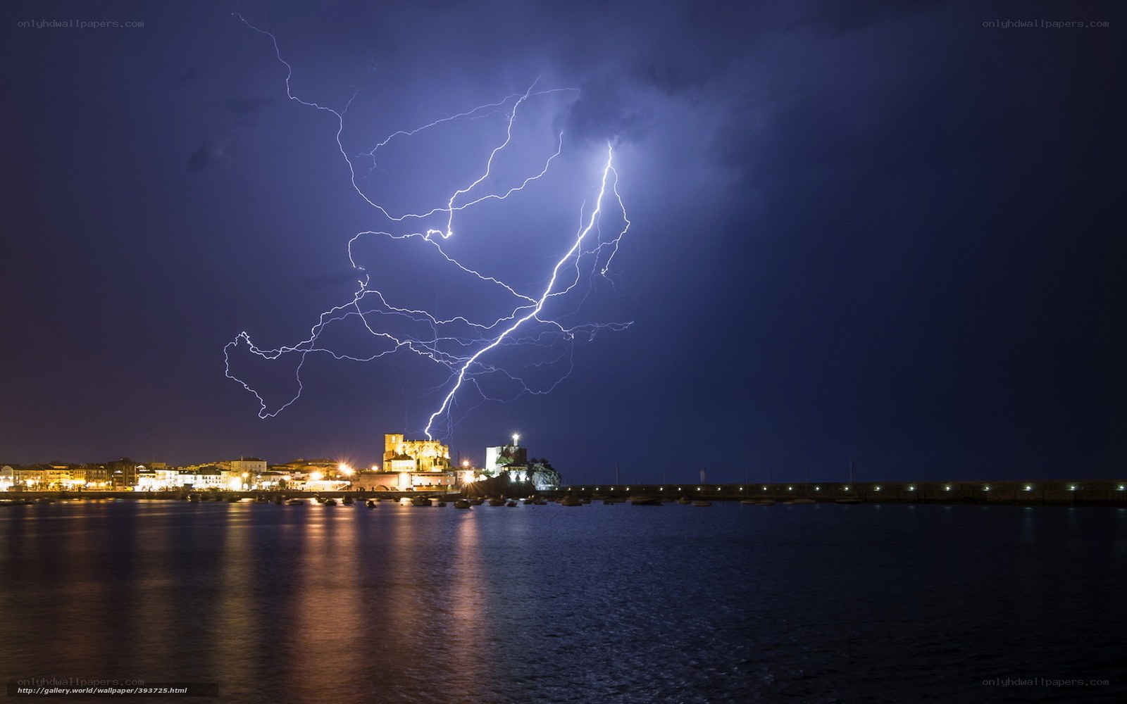 Lightning over coastal town