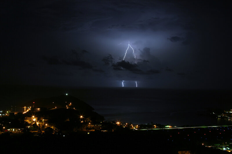 Lightning over coastal town