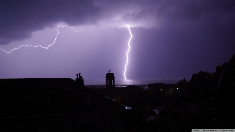 Lightning over coastal town