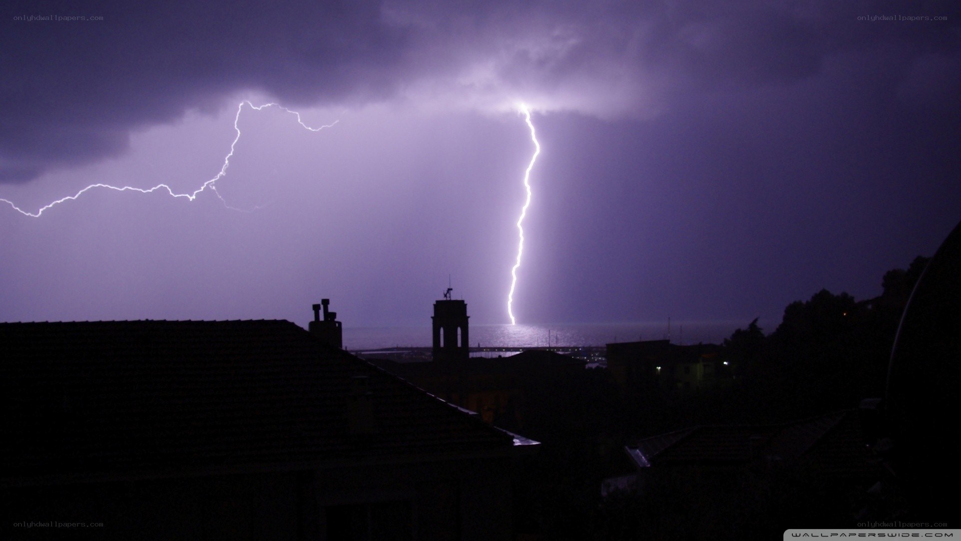 Lightning over coastal town