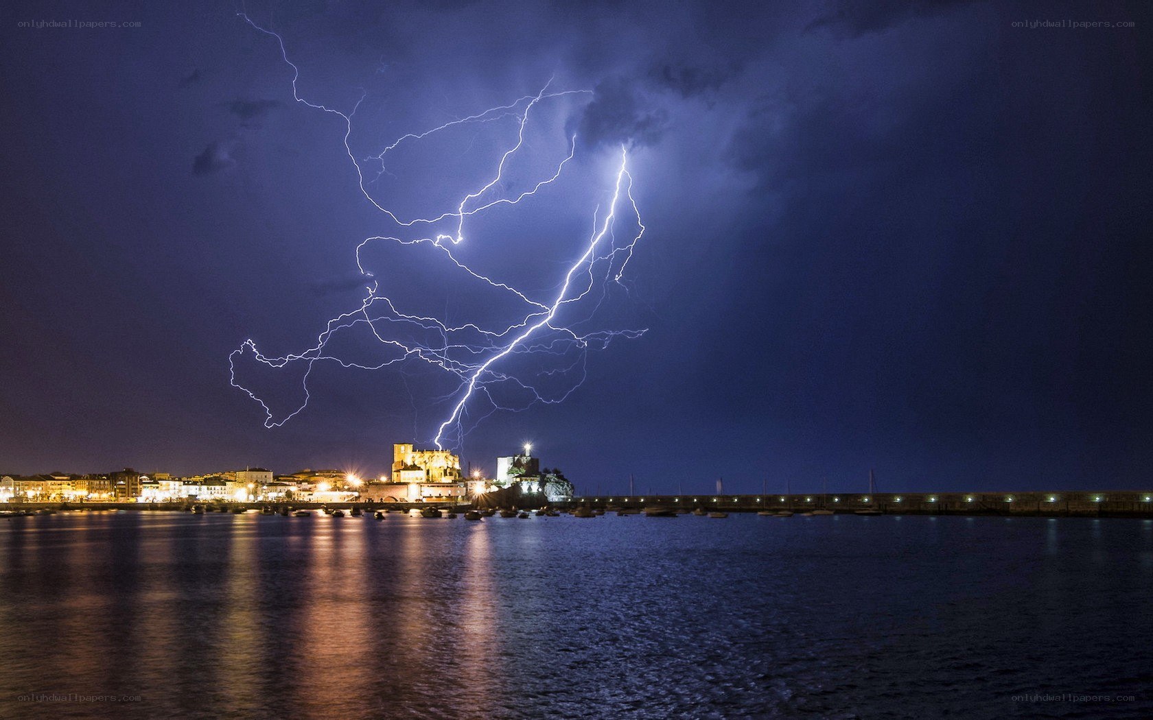 Lightning over coastal town