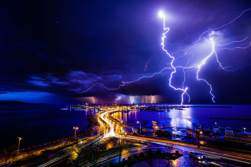 Lightning over Coastal Town — Blue, Dramatic