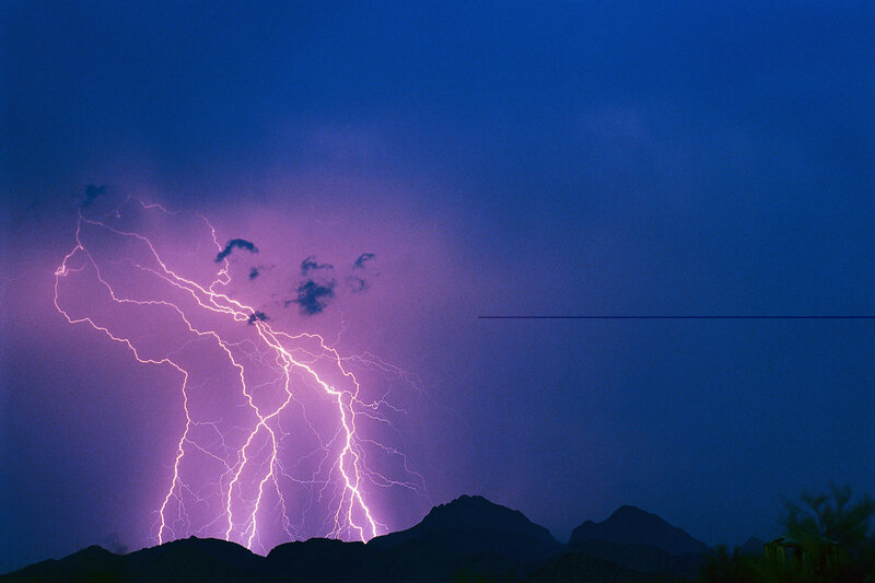 Lightning over desert mountains