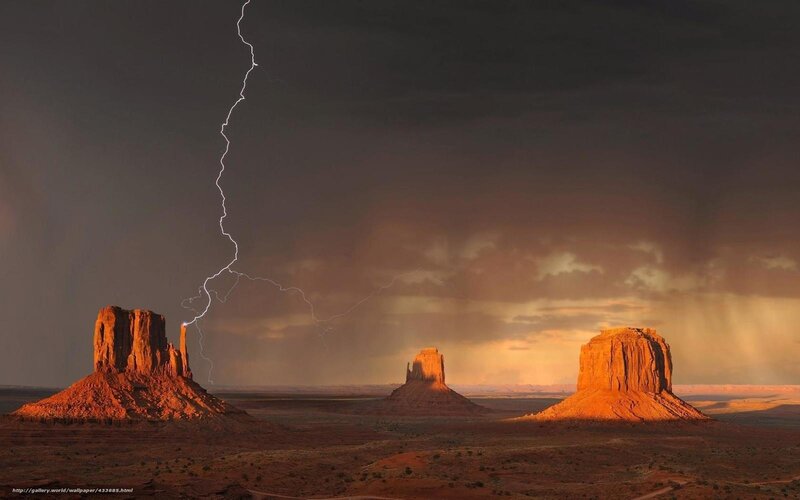 Lightning over desert rock formations